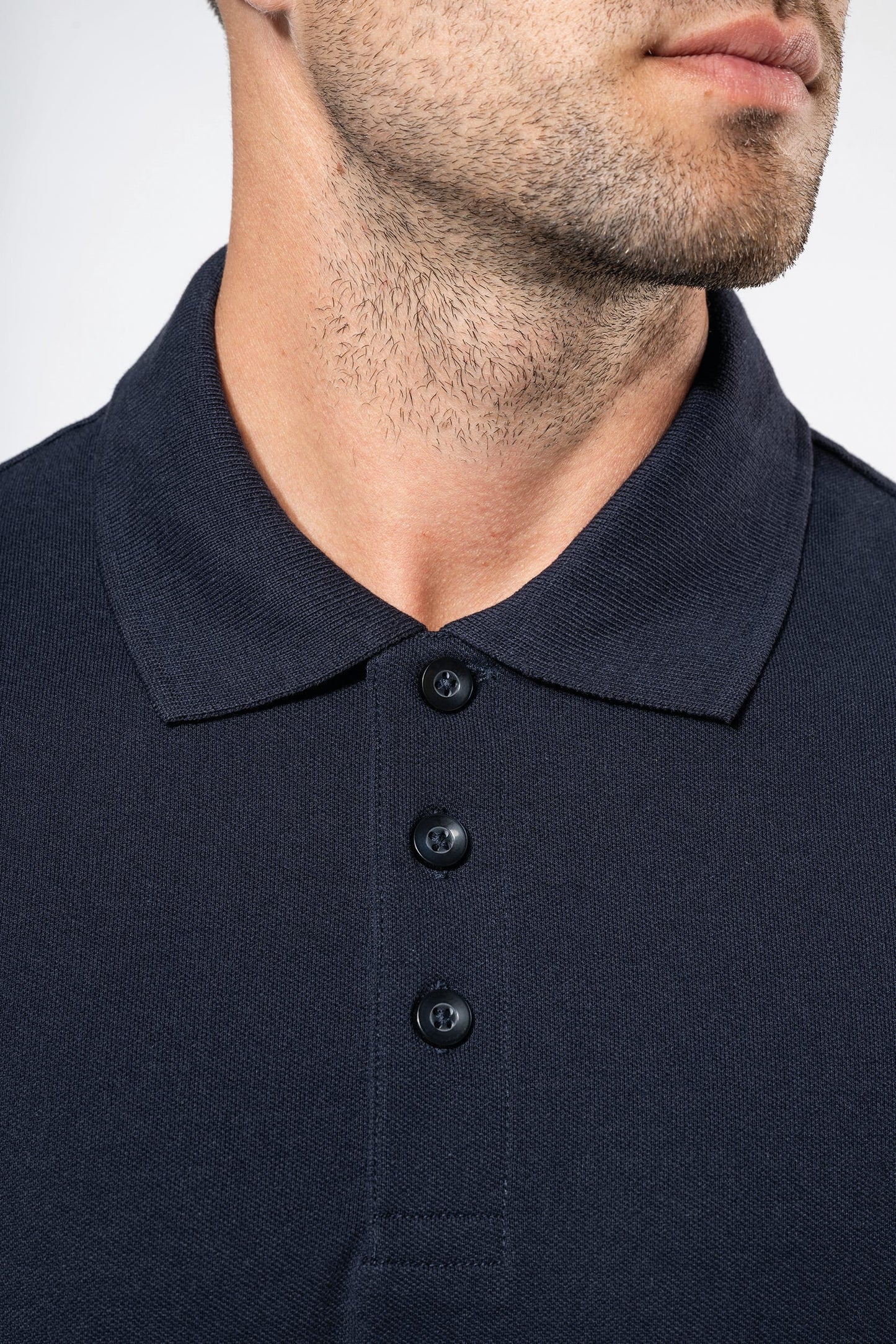 Polo de punto piqué manga corta bicolor hombre Kariban K232